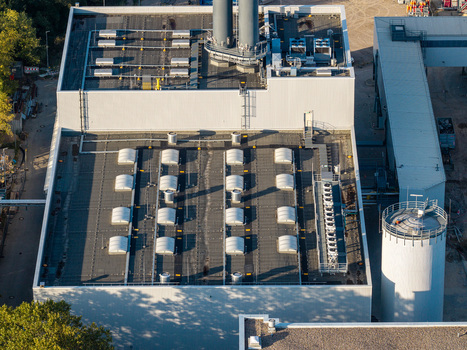 Aerial view of the Combined Heat and Power Plant Lichterfelde featuring industrial rooftops with skylights and ventilation systems in Berlin Berlin Germany. Aerial view of the Combined Heat and Power Plant Lichterfelde featuring industrial rooftops with skylights and ventilation systems in Berlin Berlin Germany.