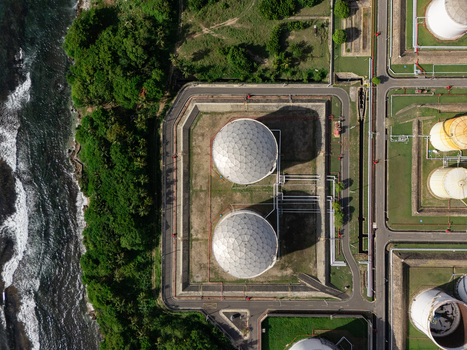 Aerial view of industrial storage tanks located along the coastline in Bajos de Haina San Cristobal Provinc Dominican Republic.