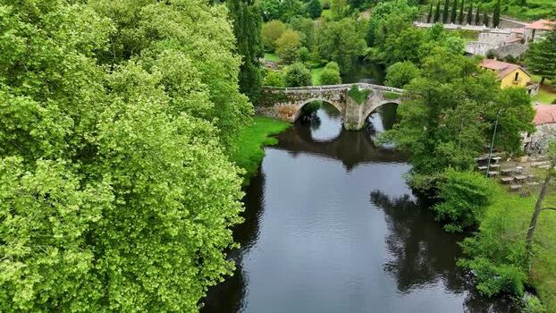 Aerial view of Rio Arnoia and the historic stone bridge Spain. Aerial view of Rio Arnoia and the historic stone bridge Spain.