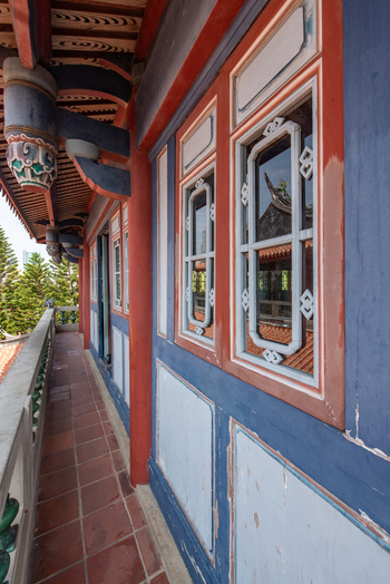 View of the ornate balcony and traditional architecture of Chihkan Tower with red pillars and intricate window frames in Chihkan Village Tainan City Taiwan. View of the ornate balcony and traditional architecture of Chihkan Tower with red pillars and intricate window frames in Chihkan Village Tainan City Taiwan.
