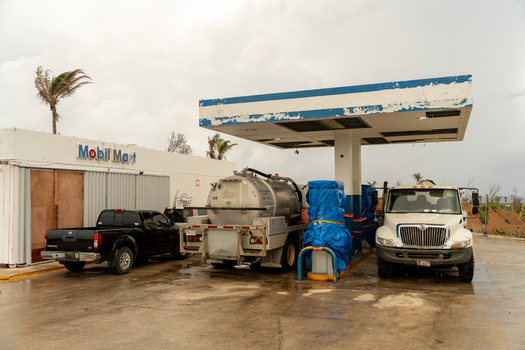 San Jose Tinian Northern Mariana Islands 05 July 2026 View of a damaged Mobil Mart gas station with a tanker truck and pickup truck parked under the canopy following a storm. San Jose Tinian Northern Mariana Islands 05 July 2026 View of a damaged Mobil Mart gas station with a tanker truck and pickup truck parked under the canopy following a storm.