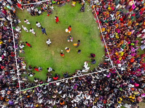 Nilphamari Bangladesh 01 May 2026 Aerial view of a large crowd gathered around a traditional stick dance performance on a green field. Nilphamari Bangladesh 01 May 2026 Aerial view of a large crowd gathered around a traditional stick dance performance on a green field.