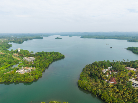 Aerial view of Koggala Lake with lush green islands and tropical vegetation under a hazy sky Koggala Southern Province Sri Lanka. Aerial view of Koggala Lake with lush green islands and tropical vegetation under a hazy sky Koggala Southern Province Sri Lanka.