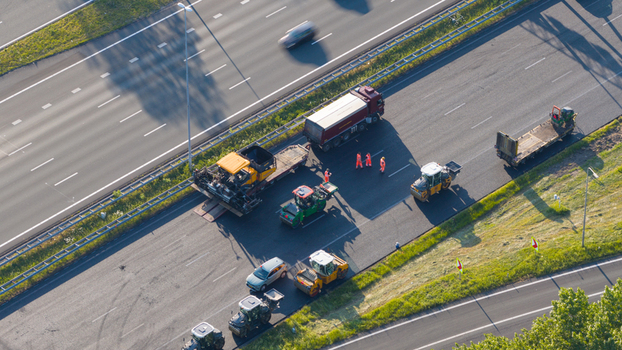 Waardenburg Netherlands 09 May 2026 Aerial view of road construction machinery and workers on a highway with asphalt pavers and rollers. Waardenburg Netherlands 09 May 2026 Aerial view of road construction machinery and workers on a highway with asphalt pavers and rollers.