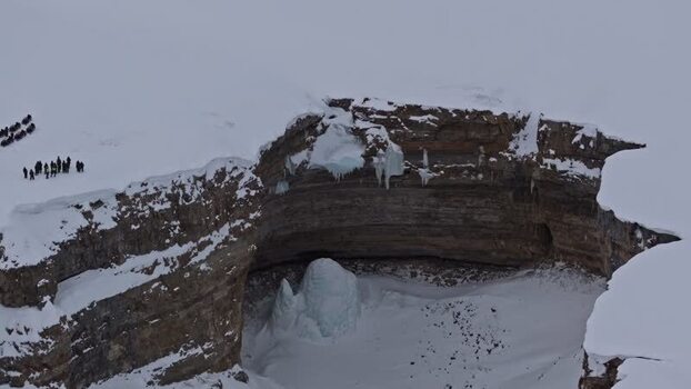 Aerial view of snowy cliffs in Pyramiden Svalbard and Jan Mayen.