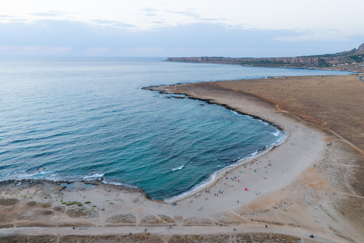 Aerial view of Riserva Naturale Orientata dello Zingaro with turquoise waters sandy beach and rocky coastline in San Vito Lo Capo Sicilia Italy. Aerial view of Riserva Naturale Orientata dello Zingaro with turquoise waters sandy beach and rocky coastline in San Vito Lo Capo Sicilia Italy.