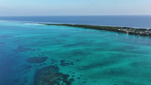 Aerial view of the tropical island of Fulhadhoo Maldives. Aerial view of the tropical island of Fulhadhoo Maldives.