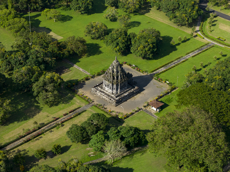 Aerial view of Bubrah Temple surrounded by lush green lawns pathways and dense trees in Kecamatan Prambanan Jawa Tengah Indonesia. Aerial view of Bubrah Temple surrounded by lush green lawns pathways and dense trees in Kecamatan Prambanan Jawa Tengah Indonesia.