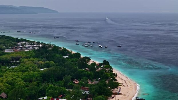 Aerial view of tropical beach with boats in Bali Indonesia.