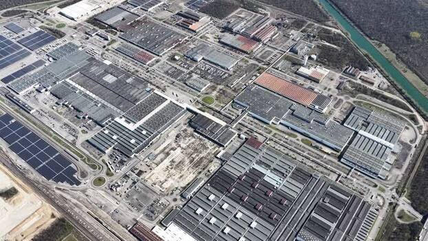 Aerial view of industrial complex with solar panels France.