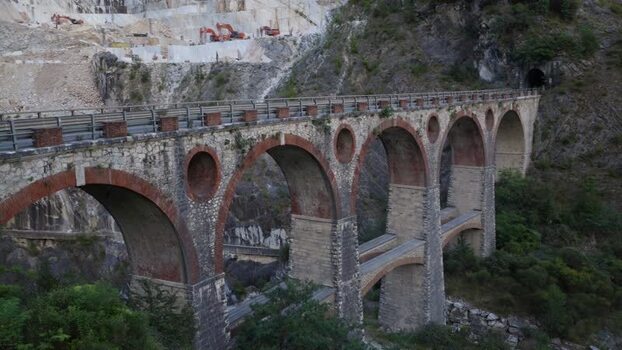 Aerial view of stone arch bridge in Carrara Italy. Aerial view of stone arch bridge in Carrara Italy.