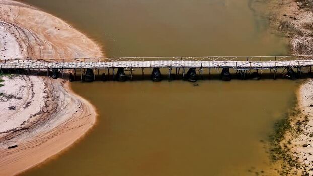 Aerial view of a bamboo bridge over a river in Bali Indonesia.