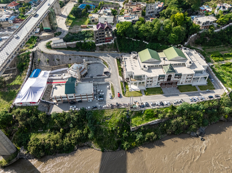 Aerial view of the Muzaffarabad bridge and surrounding buildings along the riverbank in Muzaffarabad Azad Kashmir Pakistan. Aerial view of the Muzaffarabad bridge and surrounding buildings along the riverbank in Muzaffarabad Azad Kashmir Pakistan.