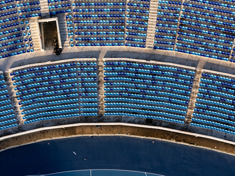 Aerial view of the blue and light blue plastic seats arranged in curved rows at a stadium in Santo Domingo Distrito Nacional Dominican Republic.
