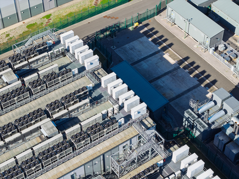 Aerial view of a data center with rows of industrial cooling units and technical infrastructure in the United Kingdom.
