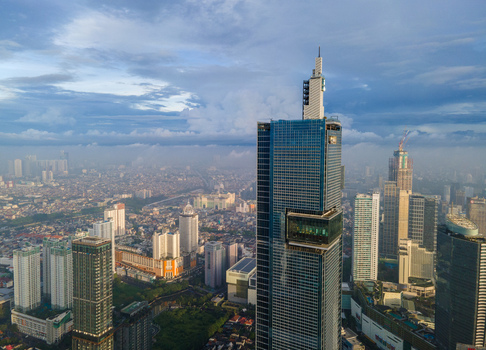 South Jakarta Indonesia 10 January 2026 Aerial view of modern skyscrapers and dense urban skyline under a cloudy blue sky in the central business district. South Jakarta Indonesia 10 January 2026 Aerial view of modern skyscrapers and dense urban skyline under a cloudy blue sky in the central business district.