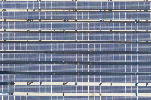 Aerial view of rows of solar panels installed in a field showcasing clean energy infrastructure in Arezzo Tuscany Italy. Aerial view of rows of solar panels installed in a field showcasing clean energy infrastructure in Arezzo Tuscany Italy.