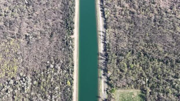 Aerial view of canal between forests France.