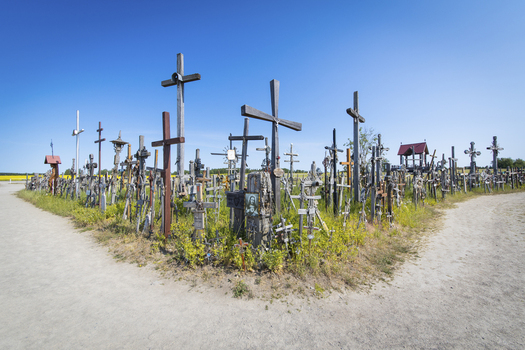 View of the Hill of Crosses with thousands of wooden and metal crosses under a clear blue sky Siauliu Siauliu apskritis Lithuania. View of the Hill of Crosses with thousands of wooden and metal crosses under a clear blue sky Siauliu Siauliu apskritis Lithuania.