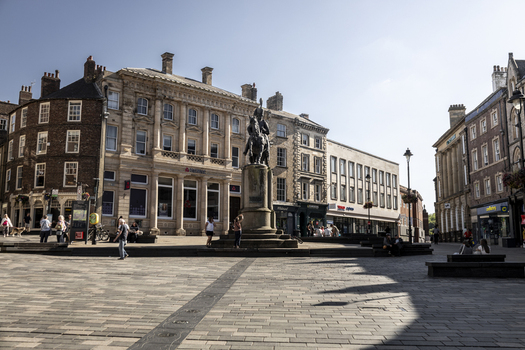 Durham United Kingdom 13 July 2026 View of the historic Market Place in Durham featuring the equestrian statue surrounded by traditional stone buildings shops and people walking. Durham United Kingdom 13 July 2026 View of the historic Market Place in Durham featuring the equestrian statue surrounded by traditional stone buildings shops and people walking.