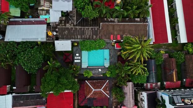 Aerial view of resort pool and villas in Bali Indonesia.