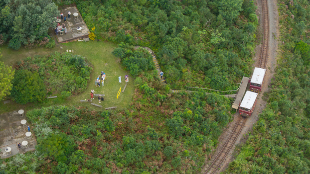 Aerial view of the Outeniqua Power Van on tracks near a lookout with people in the Outeniqua Pass Garden Route District Municipality Western Cape South Africa.