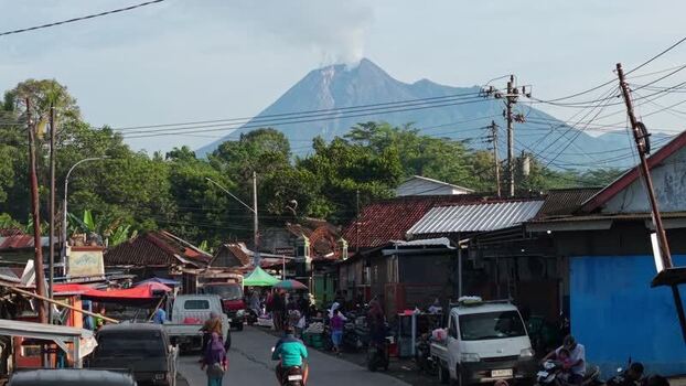 Aerial view of Mount Merapi volcano and village street Indonesia Aerial view of Mount Merapi volcano and village street Indonesia