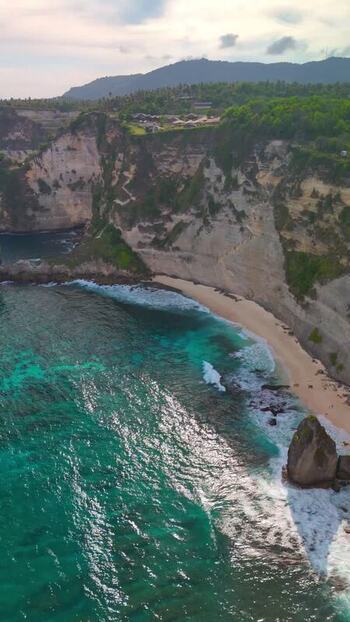 Aerial view of Diamond Beach with turquoise waves and cliffs Indonesia. Aerial view of Diamond Beach with turquoise waves and cliffs Indonesia.