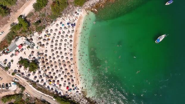 Aerial view of beach with umbrellas and boats in Thasos Greece. Aerial view of beach with umbrellas and boats in Thasos Greece.