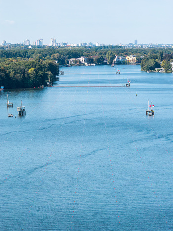 Aerial view of the Berlin Grunau Regatta Course on the Dahme river with race lanes buoys and surrounding trees under a clear sky Berlin Berlin Germany. Aerial view of the Berlin Grunau Regatta Course on the Dahme river with race lanes buoys and surrounding trees under a clear sky Berlin Berlin Germany.