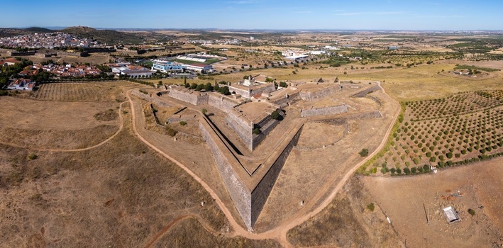 Elvas Portugal 10 September 2026 Aerial view of Forte de Santa Luzia a star shaped 17th century fortification surrounded by dry fields and olive groves under a clear blue sky. Elvas Portugal 10 September 2026 Aerial view of Forte de Santa Luzia a star shaped 17th century fortification surrounded by dry fields and olive groves under a clear blue sky.