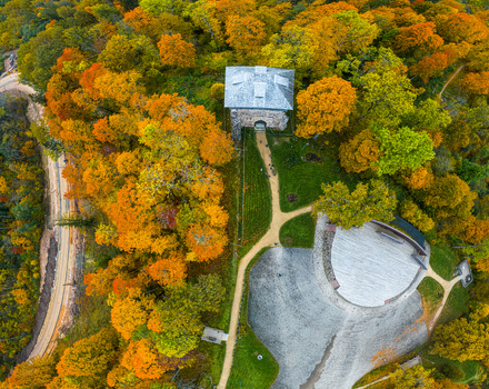 Aerial view of the historic Sigulda Castle ruins surrounded by vibrant autumn foliage and trees in Sigulda Sigulda Municipality Latvia. Aerial view of the historic Sigulda Castle ruins surrounded by vibrant autumn foliage and trees in Sigulda Sigulda Municipality Latvia.