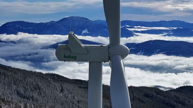 Aerial view of a wind turbine above a sea of clouds Austria. Aerial view of a wind turbine above a sea of clouds Austria.