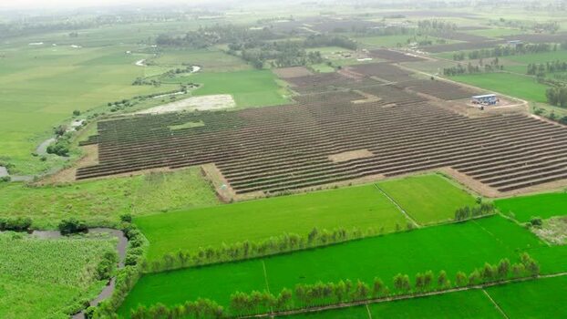 Aerial view of solar farm in rural field India.