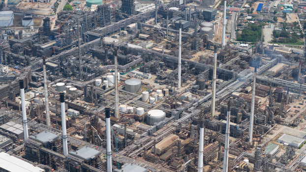 Aerial view of the Eastern Economic Corridor of Innovation EECi industrial complex with refinery pipelines storage tanks and tall smokestacks in Tambon Pa Yup Nai Chang Wat Rayong Thailand. Aerial view of the Eastern Economic Corridor of Innovation EECi industrial complex with refinery pipelines storage tanks and tall smokestacks in Tambon Pa Yup Nai Chang Wat Rayong Thailand.
