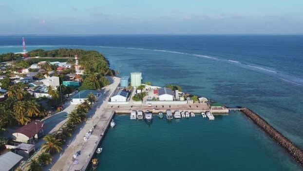 Aerial view of the harbor and tropical island of Vashafaru Maldives. Aerial view of the harbor and tropical island of Vashafaru Maldives.