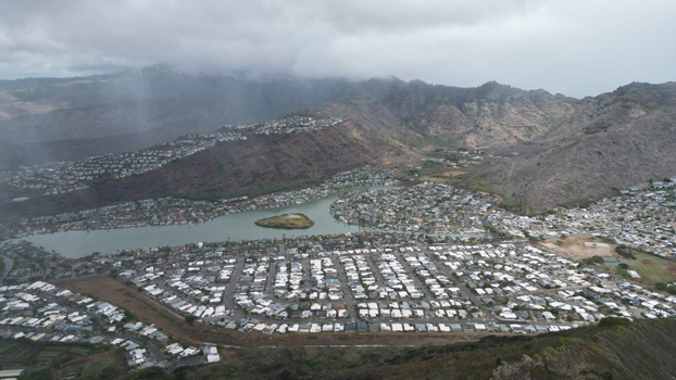 Aerial view of residential buildings nestled around a tranquil lagoon near Koko Head volcano under a clouded sky Honolulu Hawaii United States. Aerial view of residential buildings nestled around a tranquil lagoon near Koko Head volcano under a clouded sky Honolulu Hawaii United States.