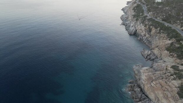 Aerial View of a boat along the coast Seccheto Elba Island Tuscany Italy.