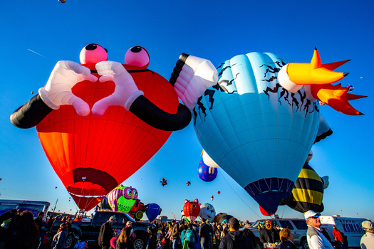 Albuquerque United States 12 October 2017 View of whimsical hot air balloons ascending against a vibrant blue sky promising adventure and wonder. Albuquerque United States 12 October 2017 View of whimsical hot air balloons ascending against a vibrant blue sky promising adventure and wonder.
