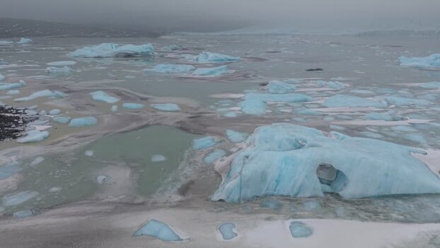 Aerial view of icebergs floating in Fjallsarlon lagoon Iceland. Aerial view of icebergs floating in Fjallsarlon lagoon Iceland.