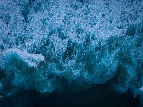 Aerial view of crashing ocean waves with white foam and deep blue water at Sandpatch Albany Western Australia Australia. Aerial view of crashing ocean waves with white foam and deep blue water at Sandpatch Albany Western Australia Australia.