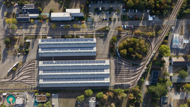 Aerial view of Rhein Neckar Verkehr GmbH rnv Betriebshof Ludwigshafen featuring depot buildings with solar panels and tram tracks in Ludwigshafen am Rhein Rheinland Pfalz Germany. Aerial view of Rhein Neckar Verkehr GmbH rnv Betriebshof Ludwigshafen featuring depot buildings with solar panels and tram tracks in Ludwigshafen am Rhein Rheinland Pfalz Germany.
