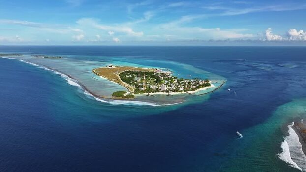 Aerial view of Thulusdhoo island and turquoise lagoons Maldives. Aerial view of Thulusdhoo island and turquoise lagoons Maldives.