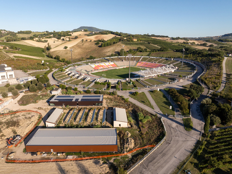 Aerial view of Stadio del Conero surrounded by rolling hills and rural landscape in Ancona Marche Italy. Aerial view of Stadio del Conero surrounded by rolling hills and rural landscape in Ancona Marche Italy.