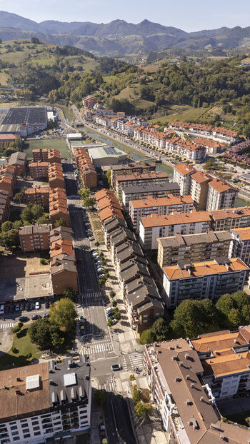 Aerial view of the town of Zumaia with its residential buildings streets and surrounding hills in Zumaia Basque Country Spain.