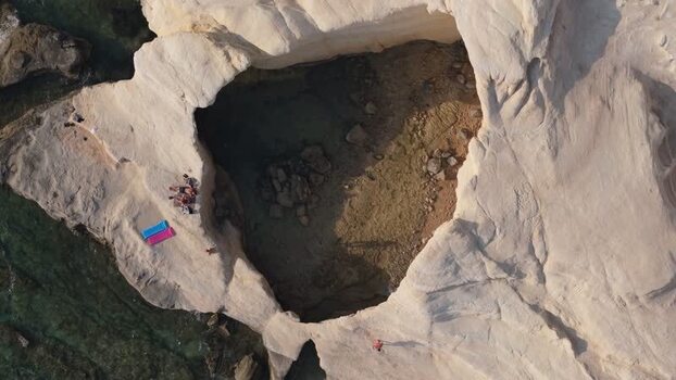 Aerial view of sea caves along the rocky coastline of Cyprus.