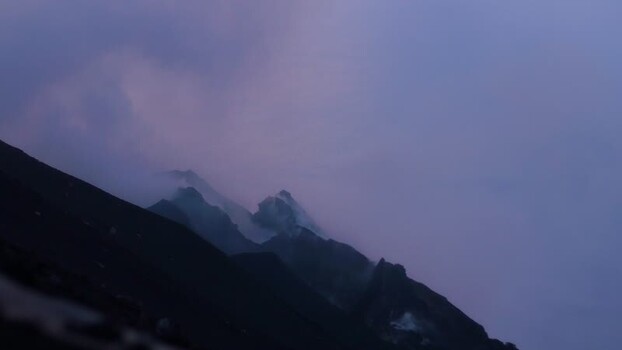 View of Stromboli volcano with volcanic smoke Italy.