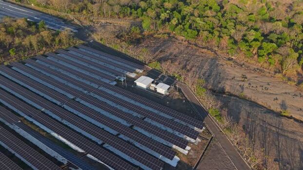 Aerial view of PLTS Bali Timur solar power plant in Indonesia. Aerial view of PLTS Bali Timur solar power plant in Indonesia.