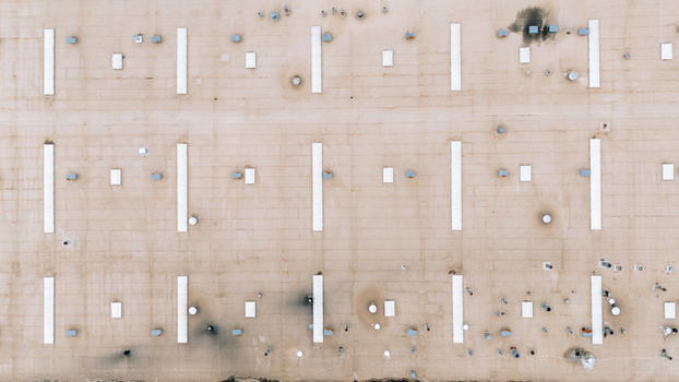 Aerial view of a patterned landscape with long white lines and dark spots creates a stark geometric contrast from above Sremska Mitrovica Vojvodina Serbia. Aerial view of a patterned landscape with long white lines and dark spots creates a stark geometric contrast from above Sremska Mitrovica Vojvodina Serbia.