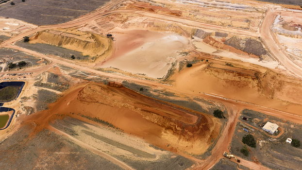 Aerial view of industrial sand and salt extraction patterns with brown and yellow earth textures near Kalbarri Western Australia Australia. Aerial view of industrial sand and salt extraction patterns with brown and yellow earth textures near Kalbarri Western Australia Australia.